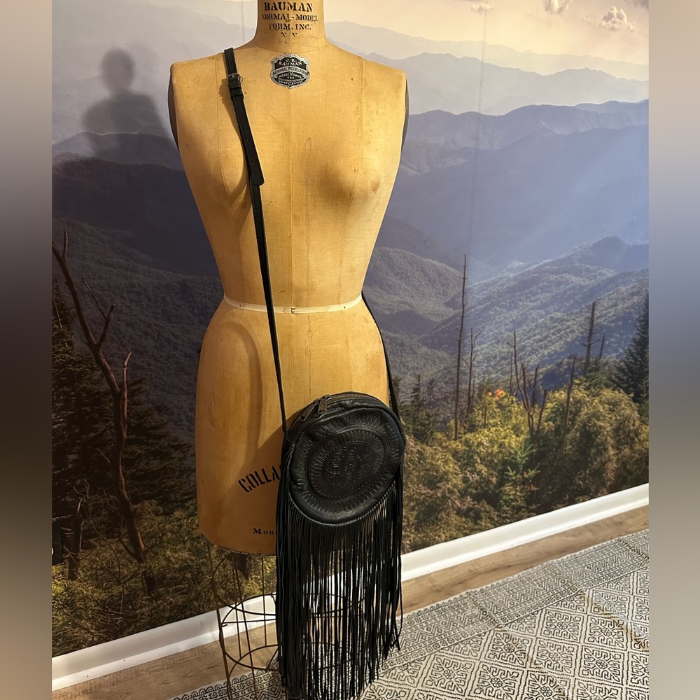 Patricia Nash black round crossbody bag with fringe